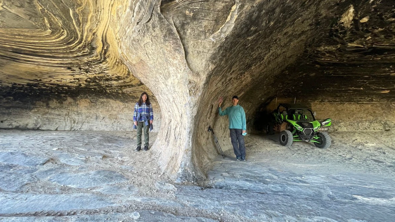 Towering sandstone cave wall on an Adventure Tours Vernal backcountry tour