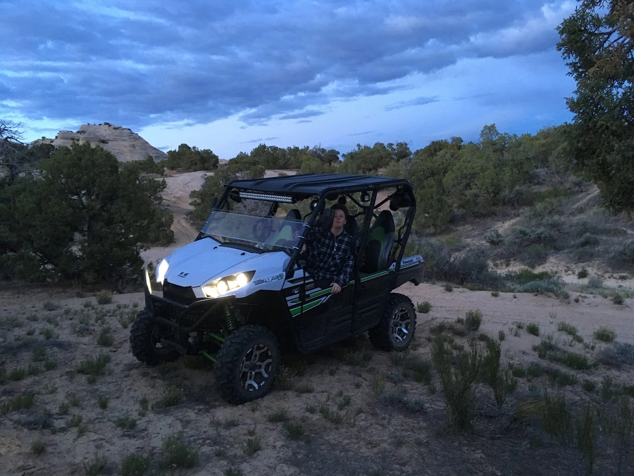 Side-by-side UTV on slickrock at dusk near Dinosaur National Monument, Vernal Utah