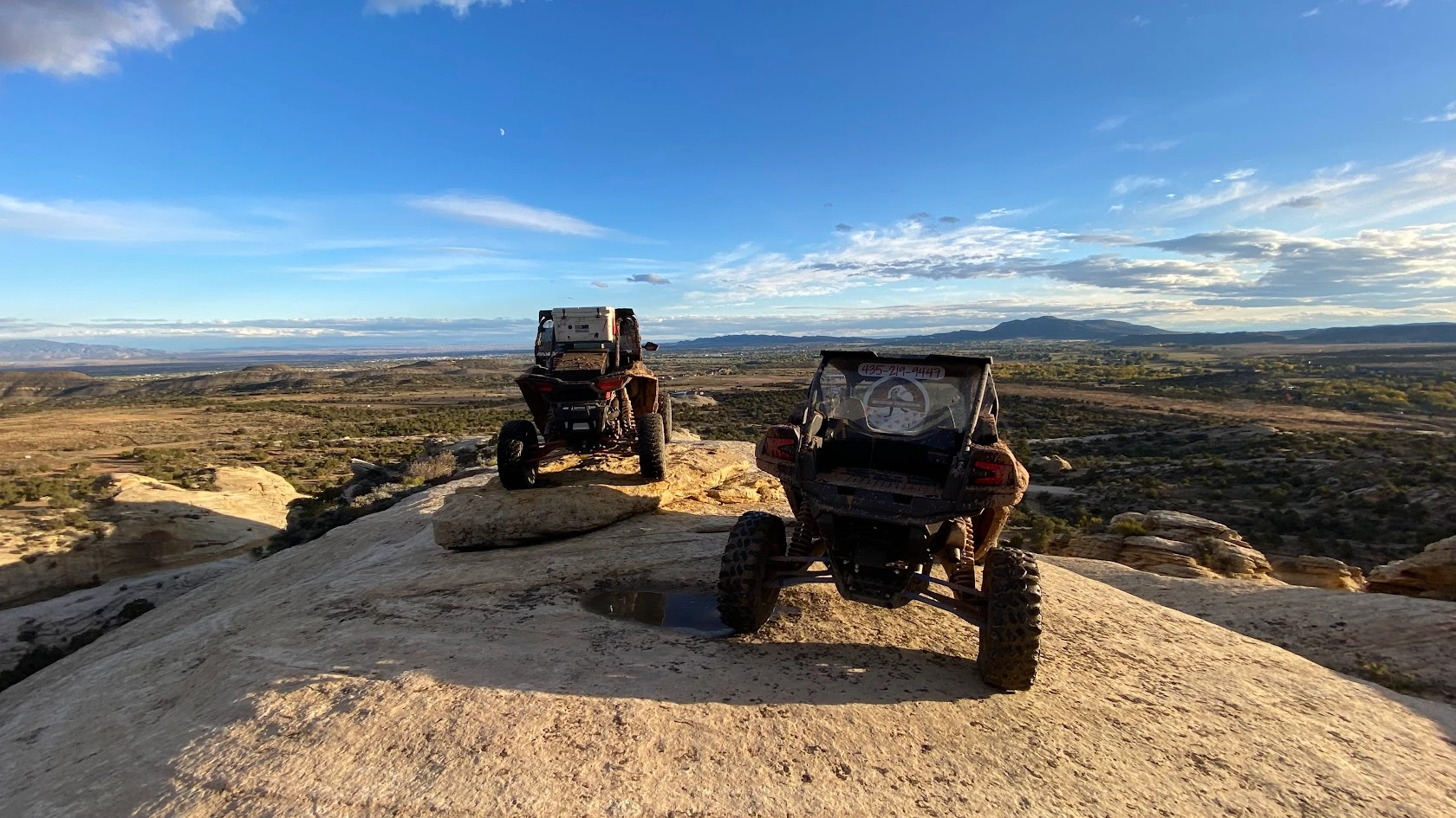 Side-by-side UTVs on a rock ridge formation on a guided tour in Vernal Utah