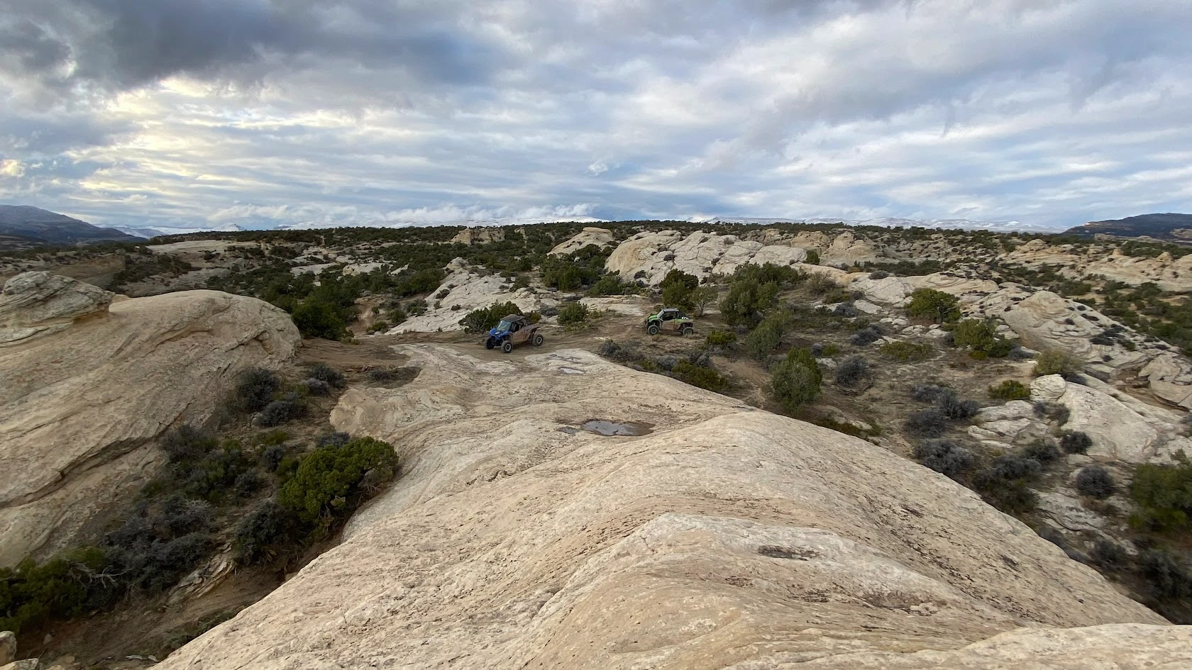 Side-by-side UTV at a slickrock dome overlook near Vernal Utah