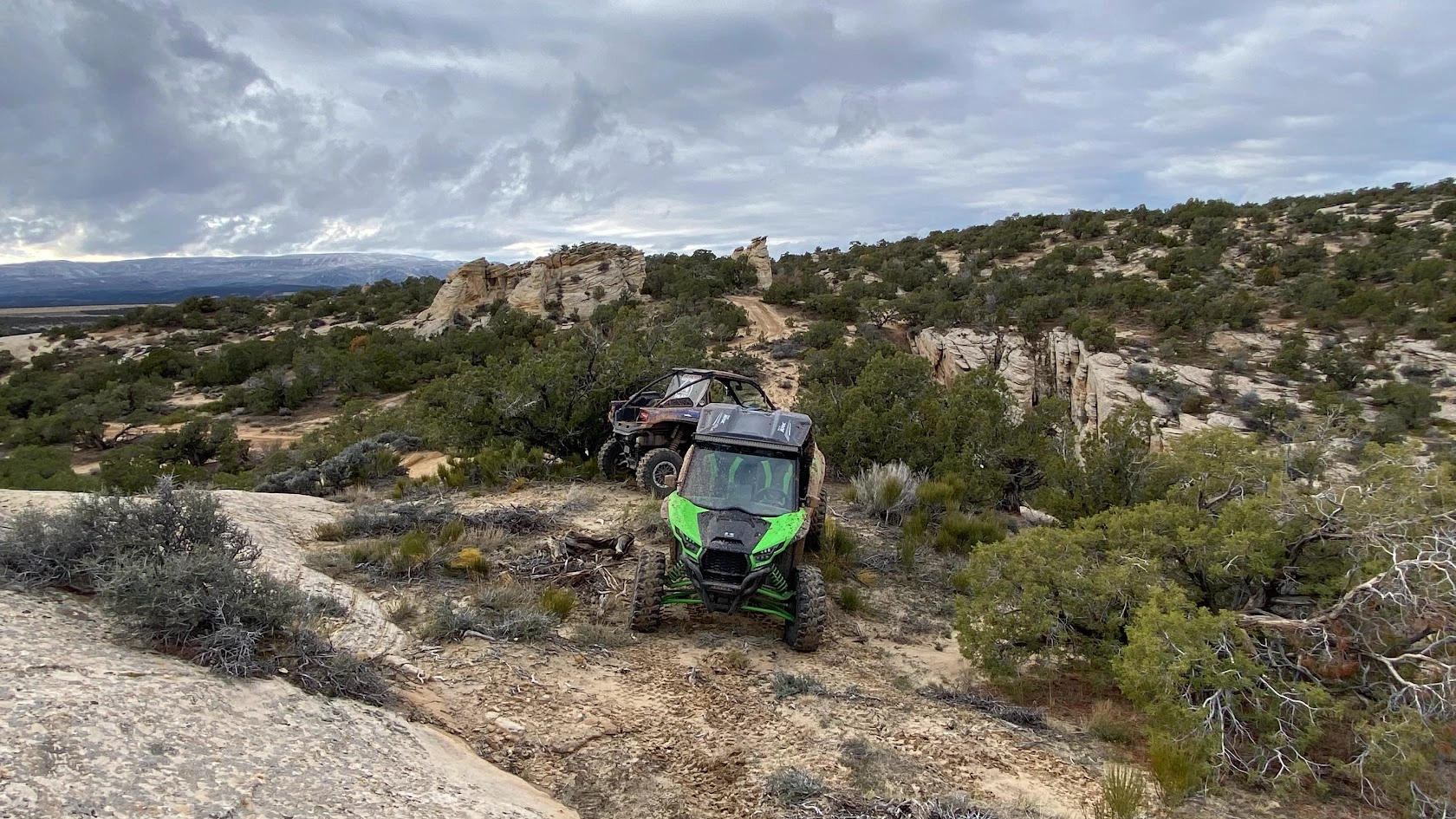 Green side-by-side UTV on a desert trail near Vernal Utah