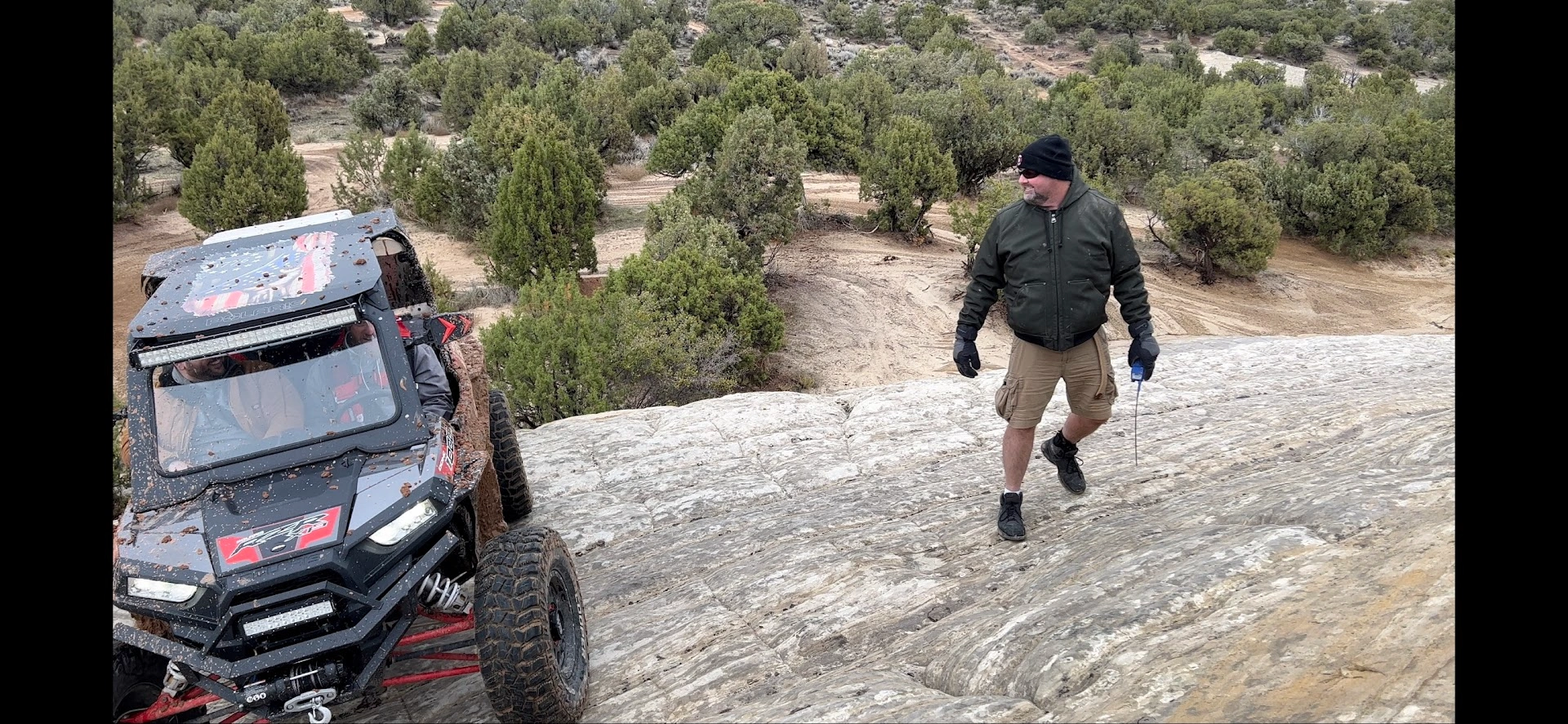Guided side-by-side UTV rock crawl through a sandstone wash near Vernal Utah