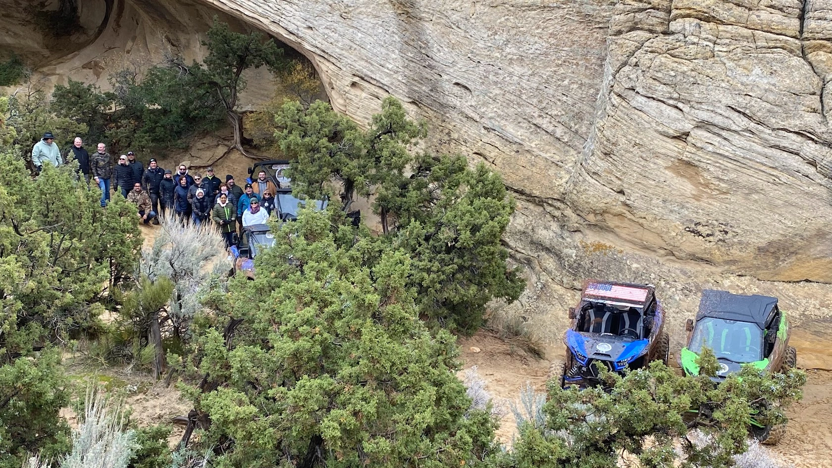 Side-by-side UTVs parked at a cliffside on a guided tour near Vernal Utah
