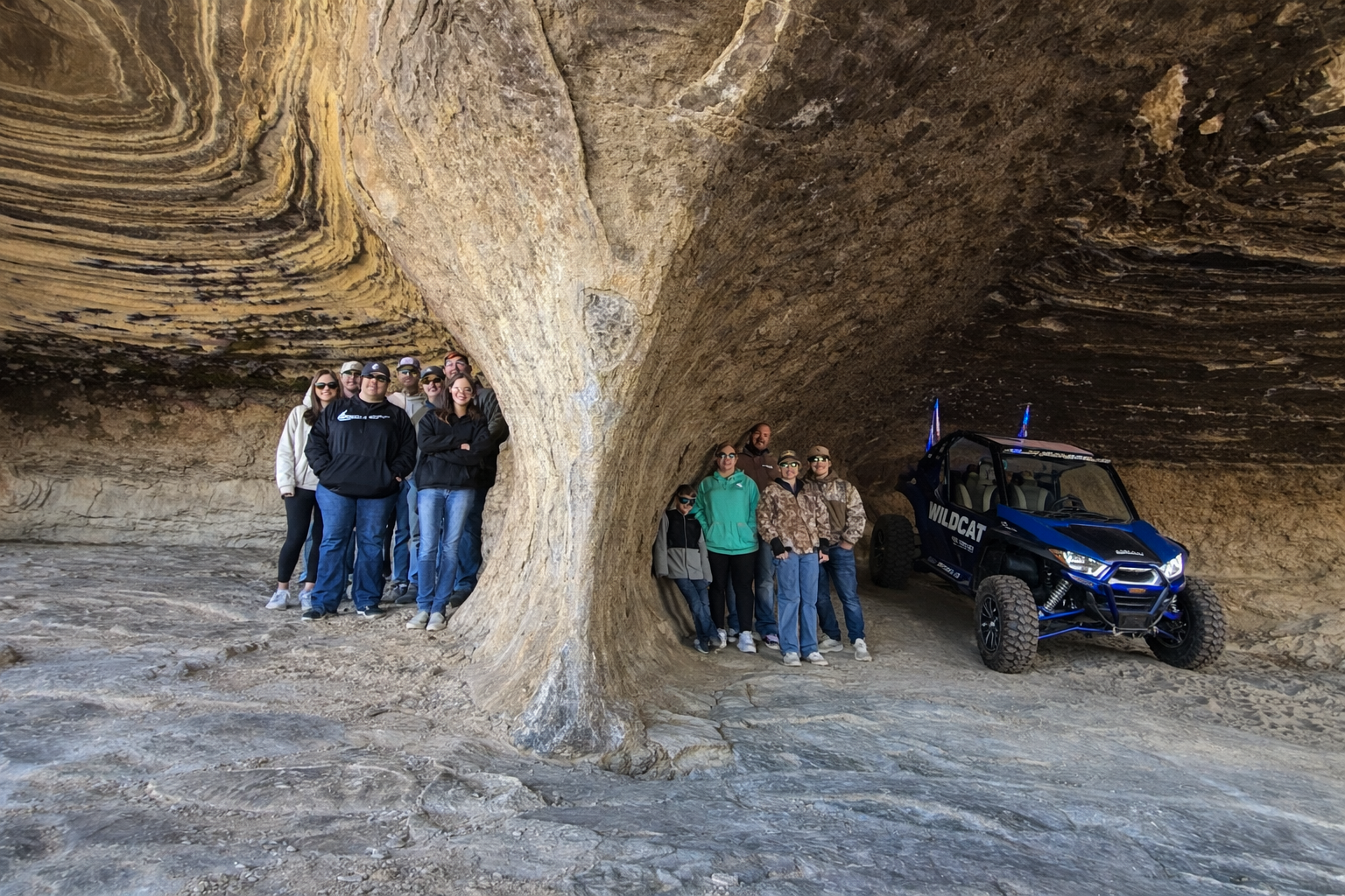 Inside a sandstone cave on an Adventure Tours Vernal backcountry tour