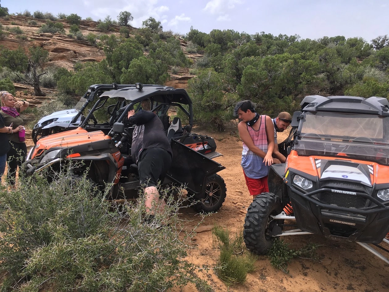 Group stopped with their side-by-side UTVs along a backcountry trail near Vernal Utah