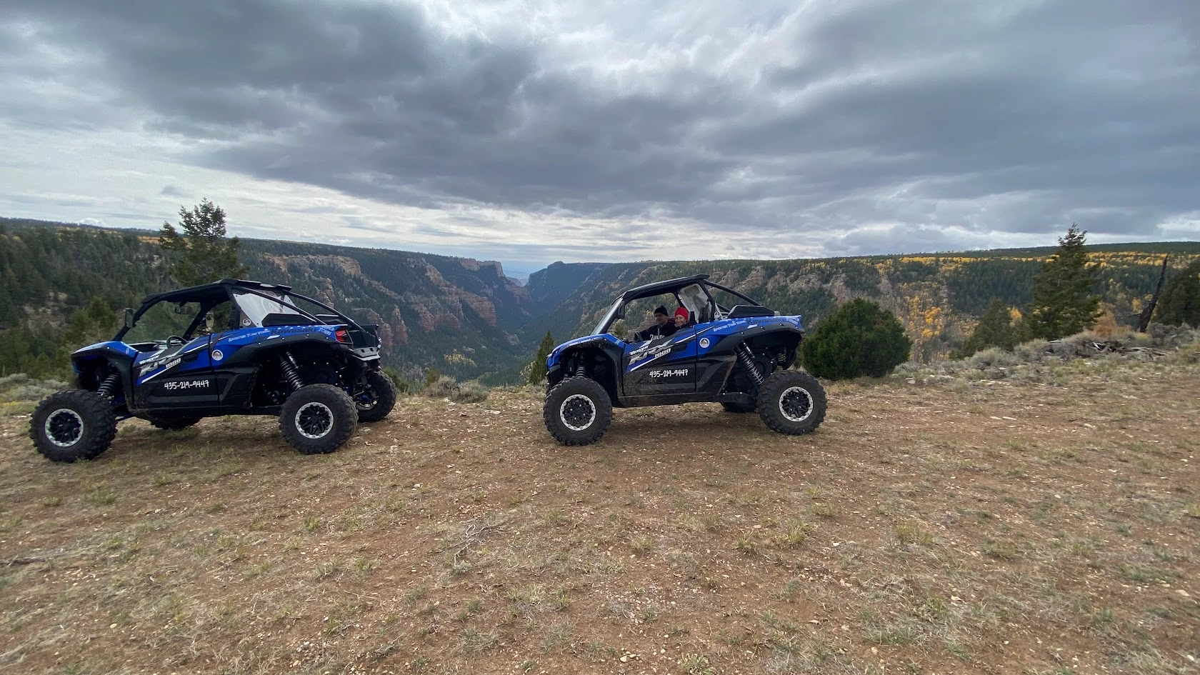 Side-by-side UTVs above the canyon on a backcountry tour near Vernal Utah