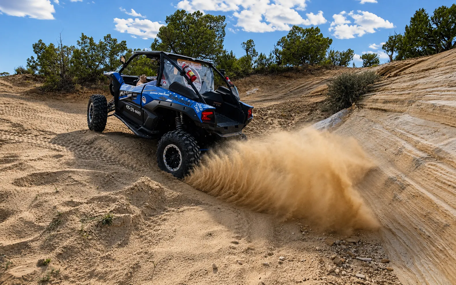 Side-by-side UTV spraying sand through a turn near Vernal Utah