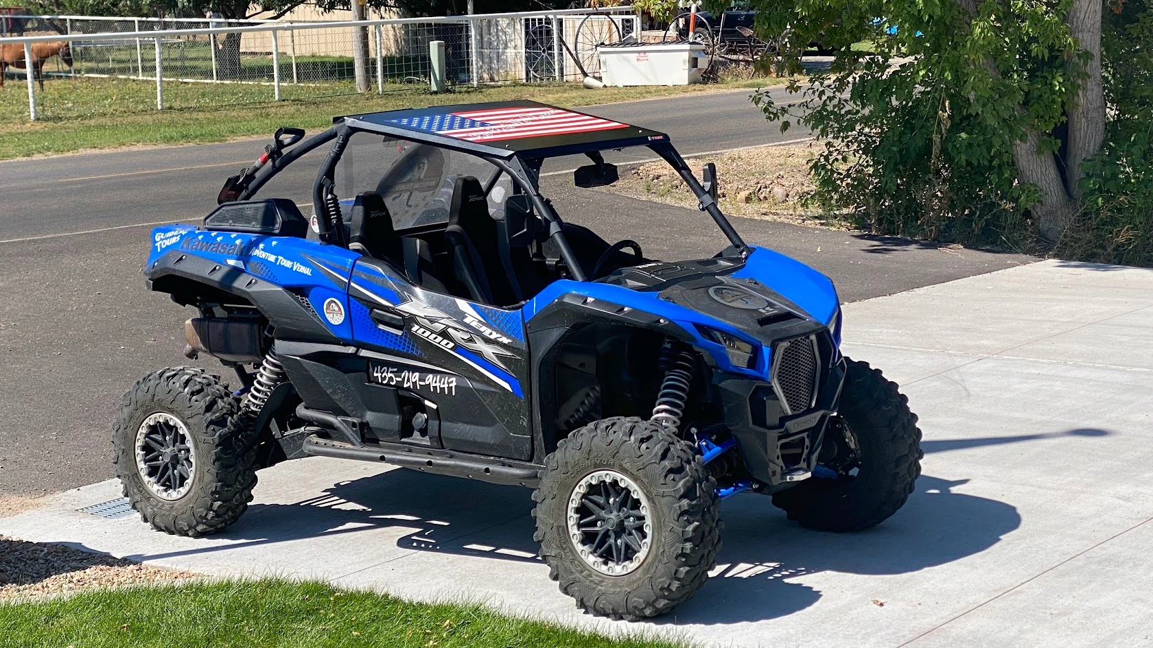 Side-by-side UTV flying an American flag at rest near Vernal Utah